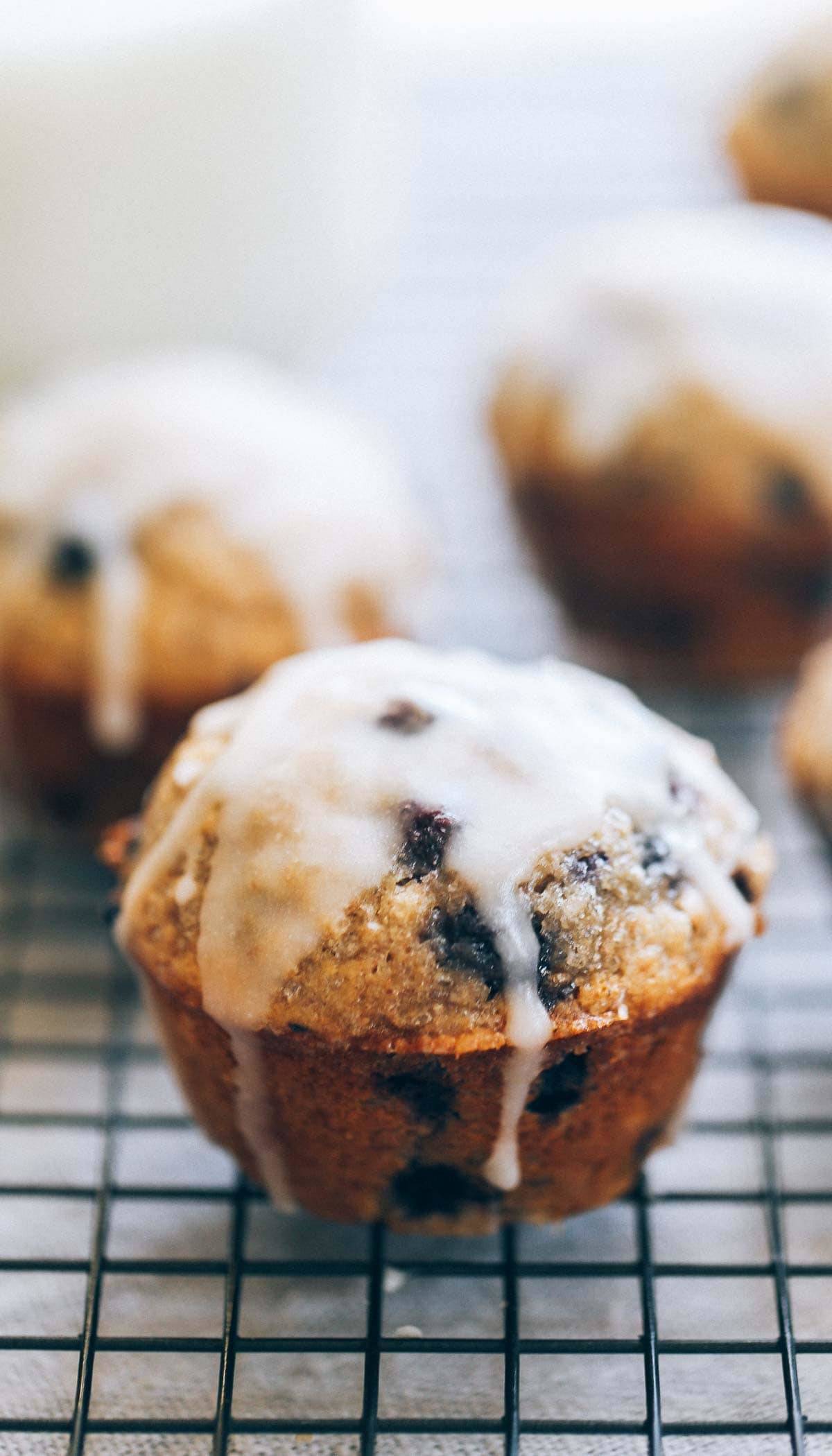 Whole Wheat Blueberry Muffin with glaze on a drying rack.