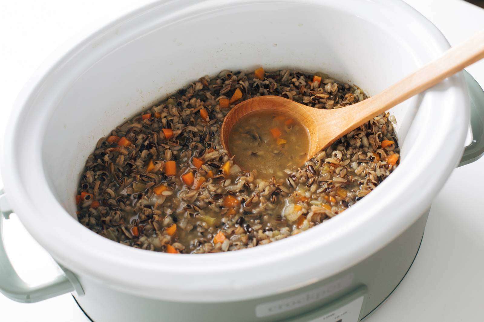 Wild rice soup cooked in a slow cooker.