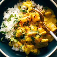 Yellow chicken curry in a bowl with a spoon