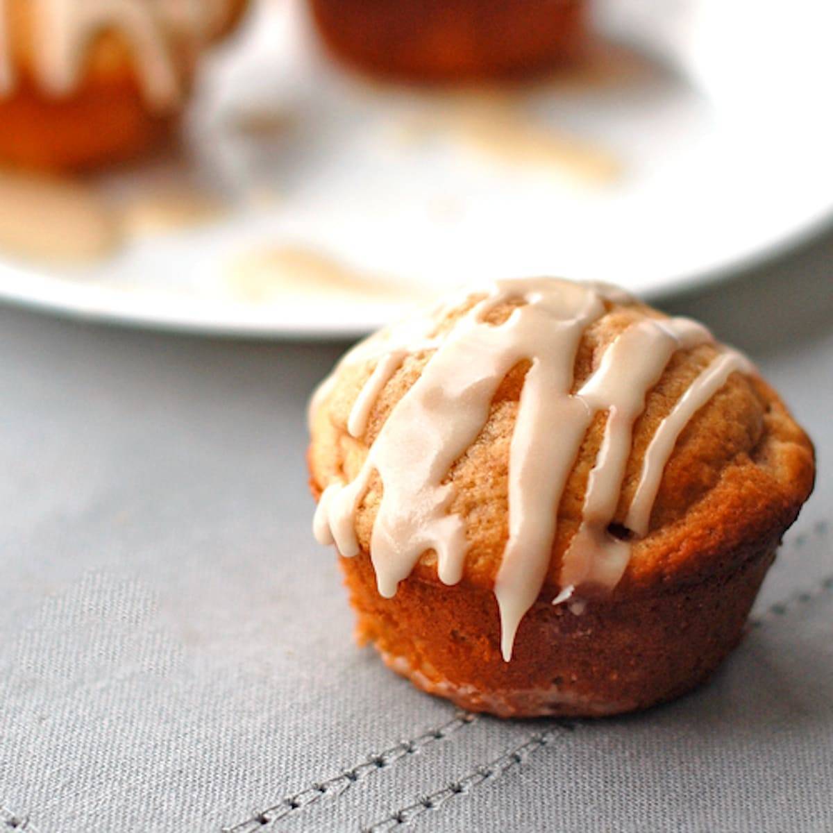 Apple cinnamon muffin topped with a warm vanilla glaze. 
