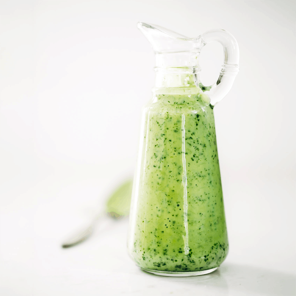 Avocado cilantro dressing in a dressing container