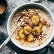Caramelized Banana Oatmeal in bowl with spoon.