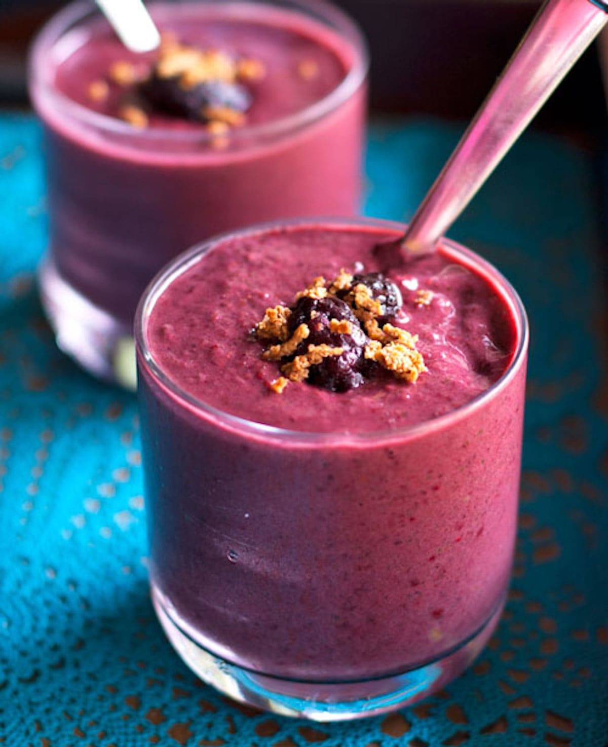 Berry green smoothies in glasses.