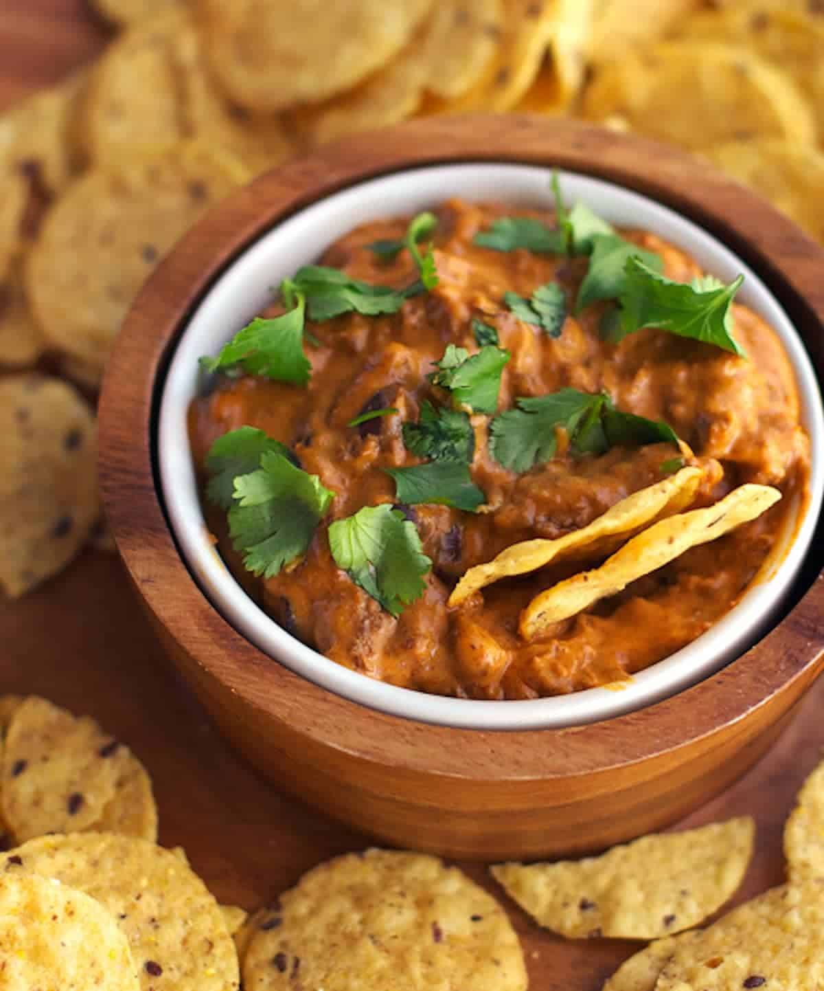 Chili cheese black bean dip with tortilla chips. 