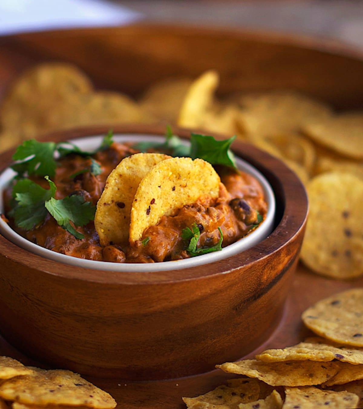 Chili cheese black bean dip with tortilla chips. 