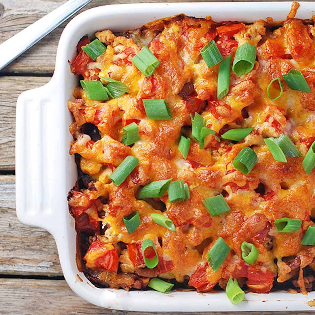 Black bean casserole with ground turkey, black beans, peppers, and cheese. 