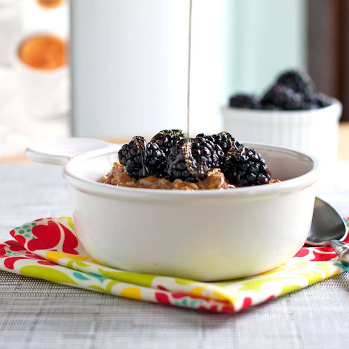 Blackberries and cream oats topped with honey and fresh blackberries. 