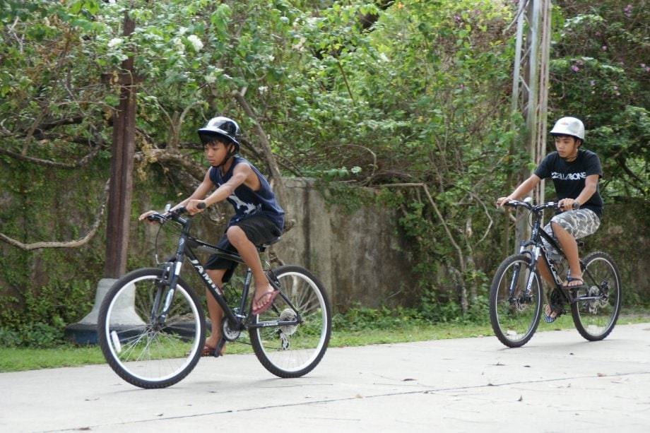 Bohol Field Trip boys riding bikes.