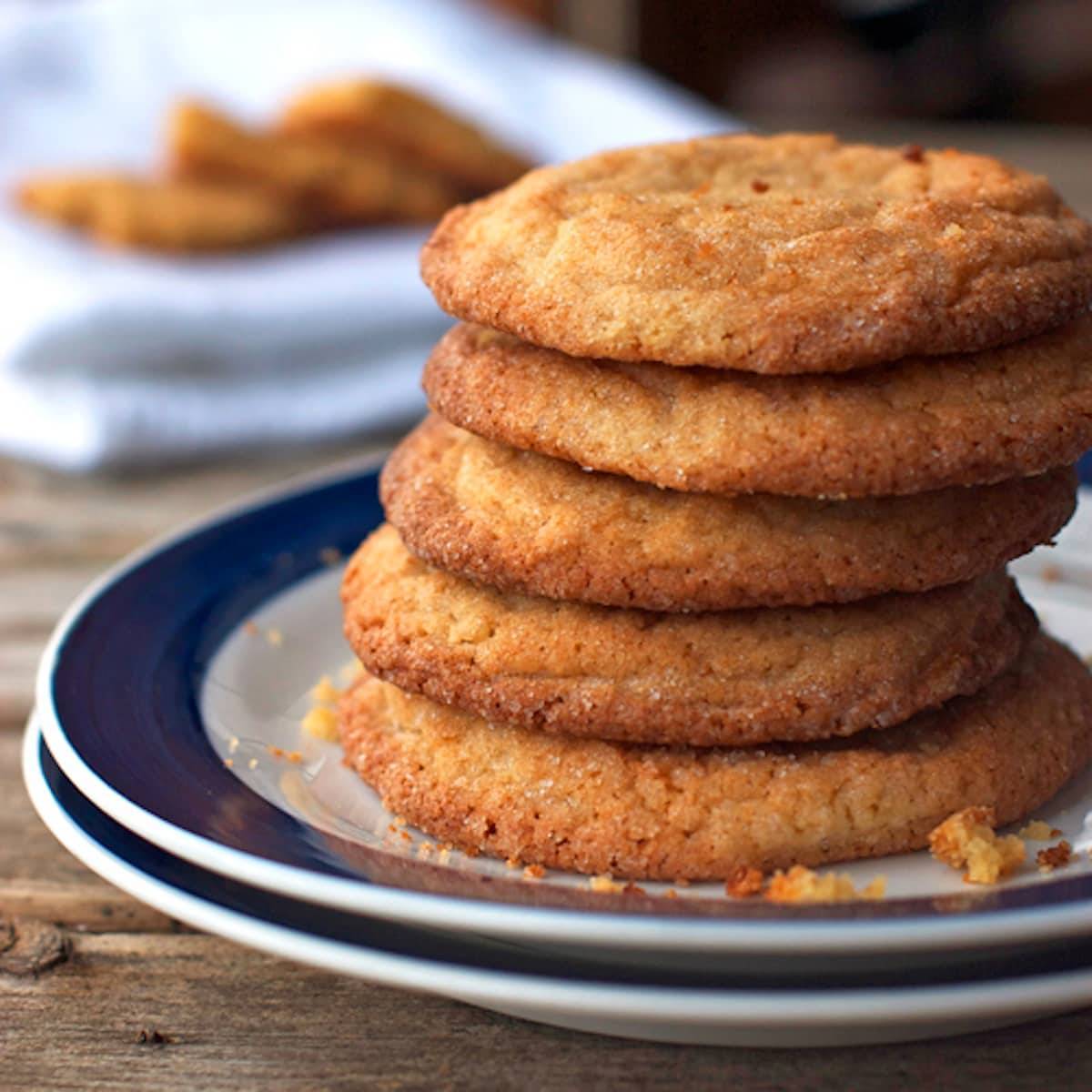 Brown sugar cookies stacked on a plate.