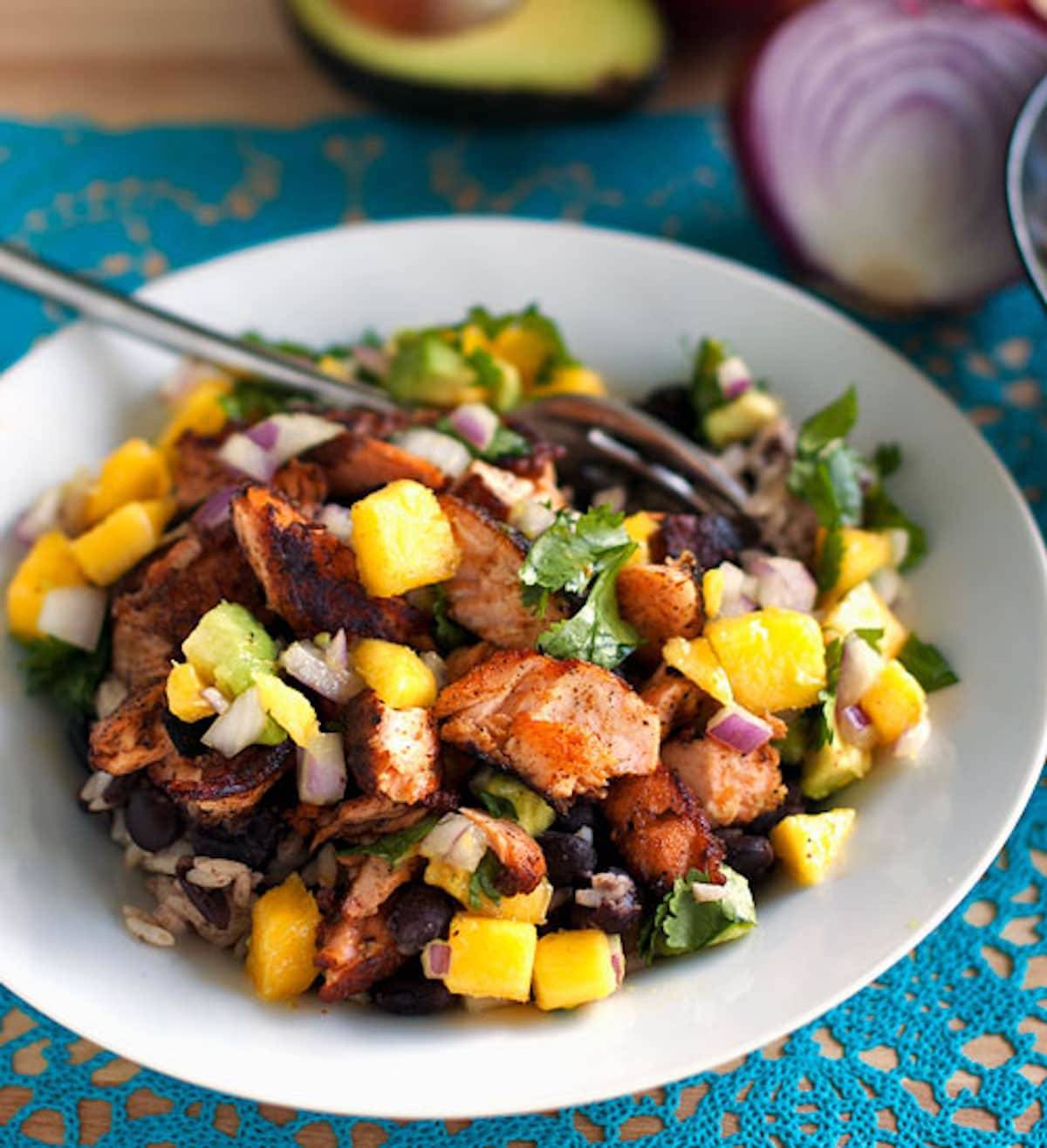 Caribbean jerk salmon bowl with mango salsa.