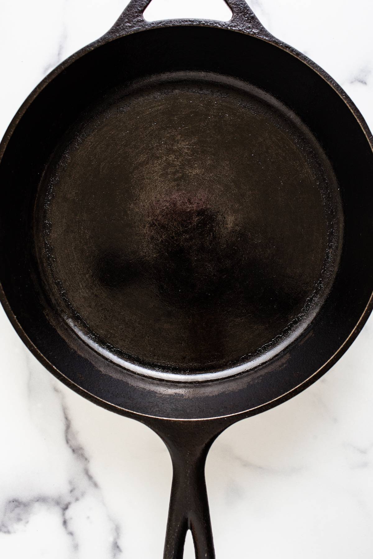 Clean and seasoned Pan made of cast iron.