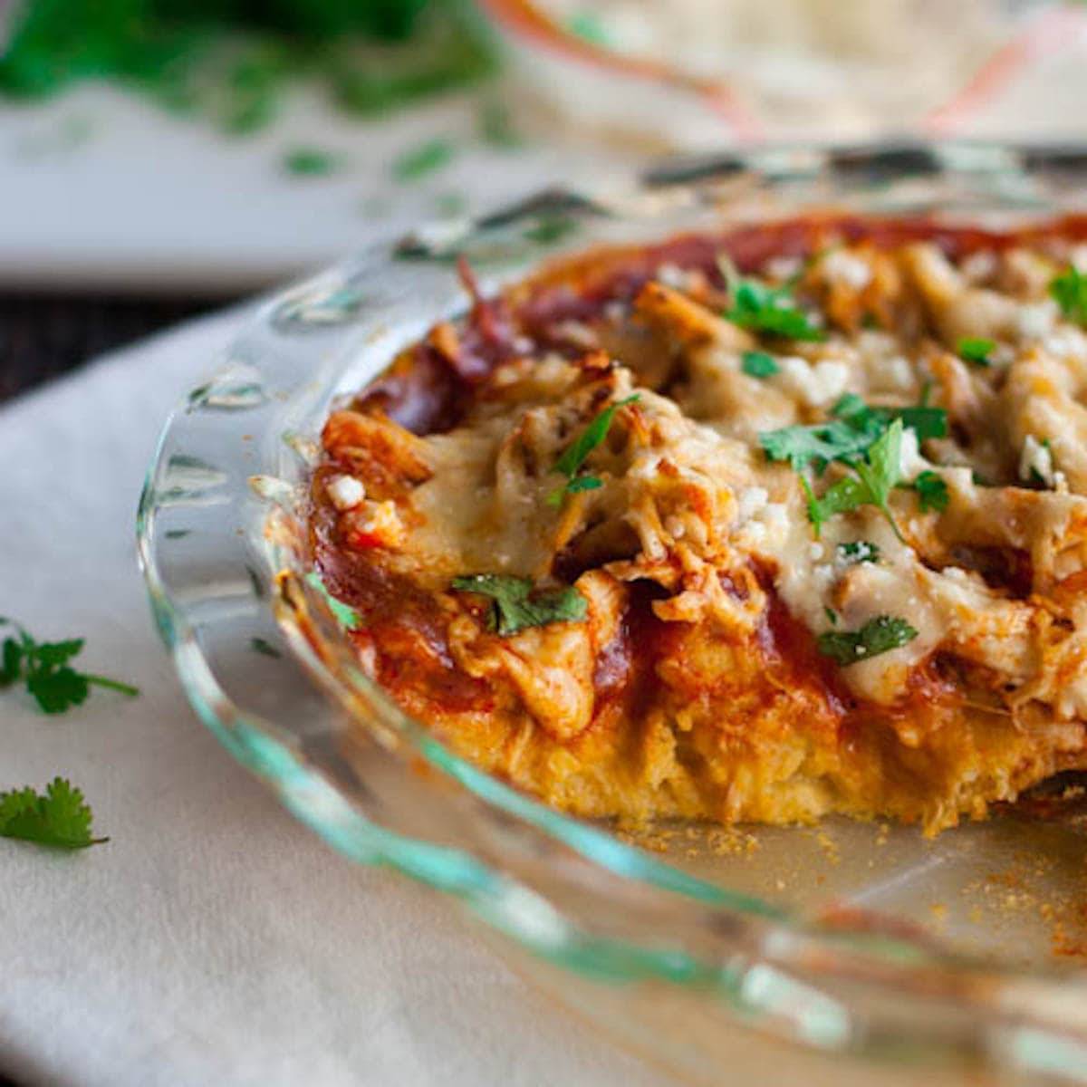 Chicken tamale pie in a clear baking dish.