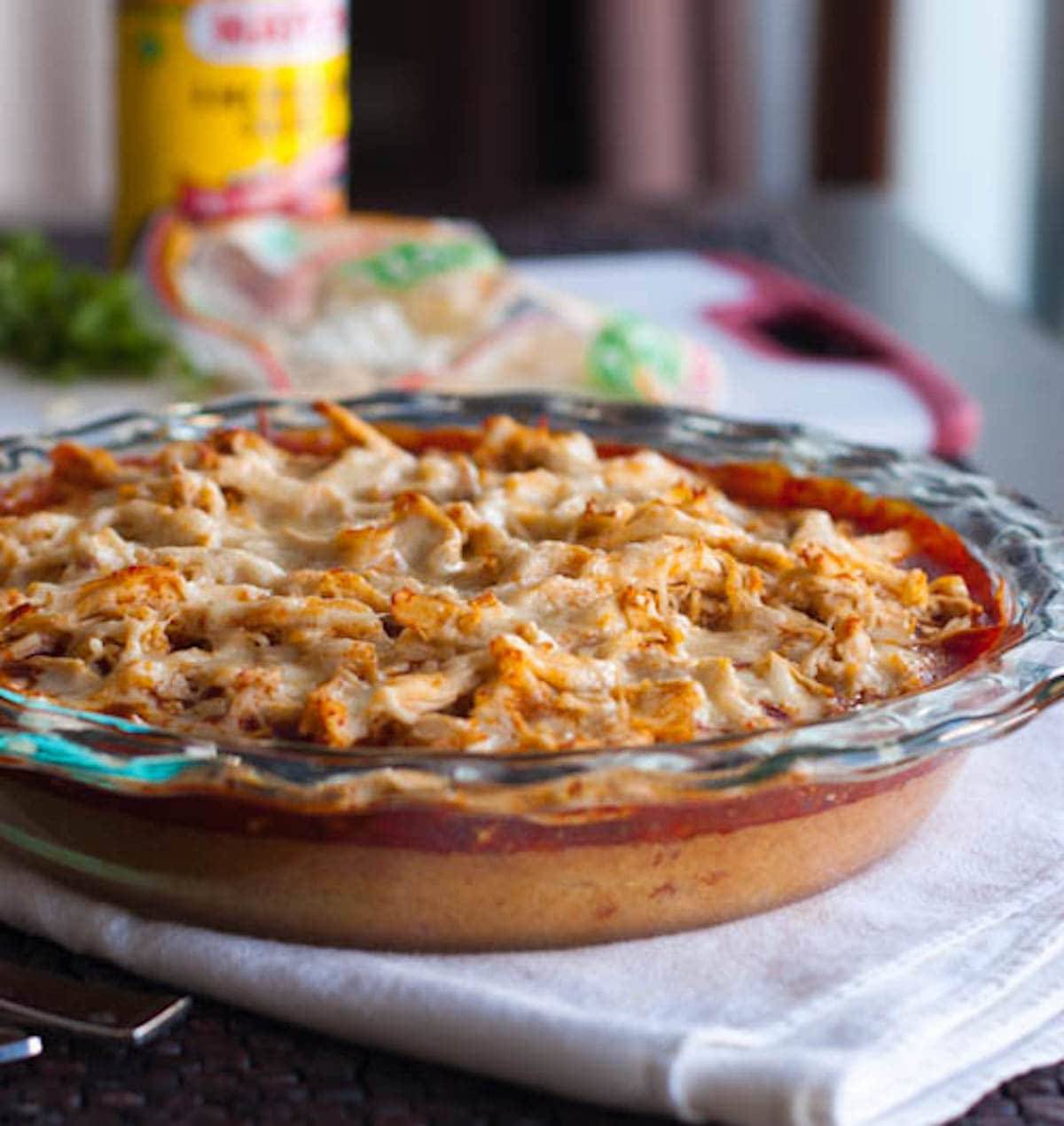 Chicken tamale pie in a clear baking dish.