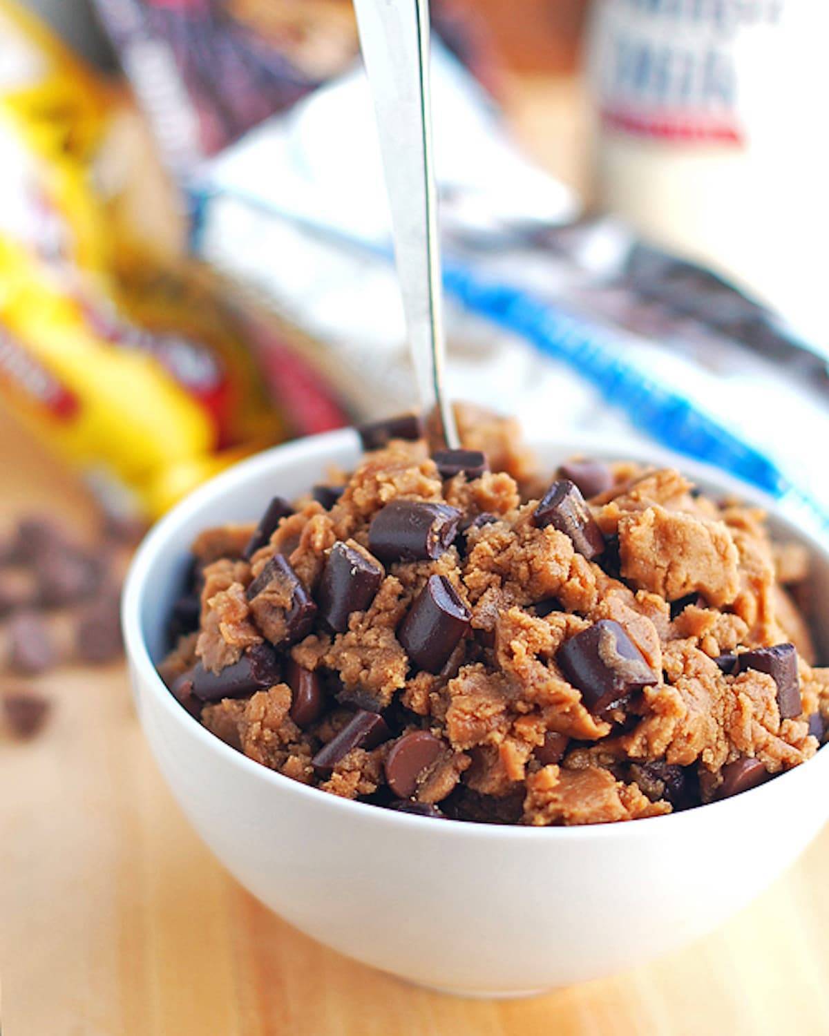 Malted double chocolate chip cookie dough in a white bowl.