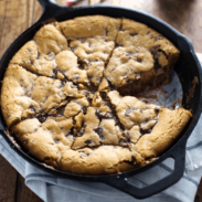 Deep Dish Chocolate Chip Cookie with Caramel and Sea Salt in a skillet.