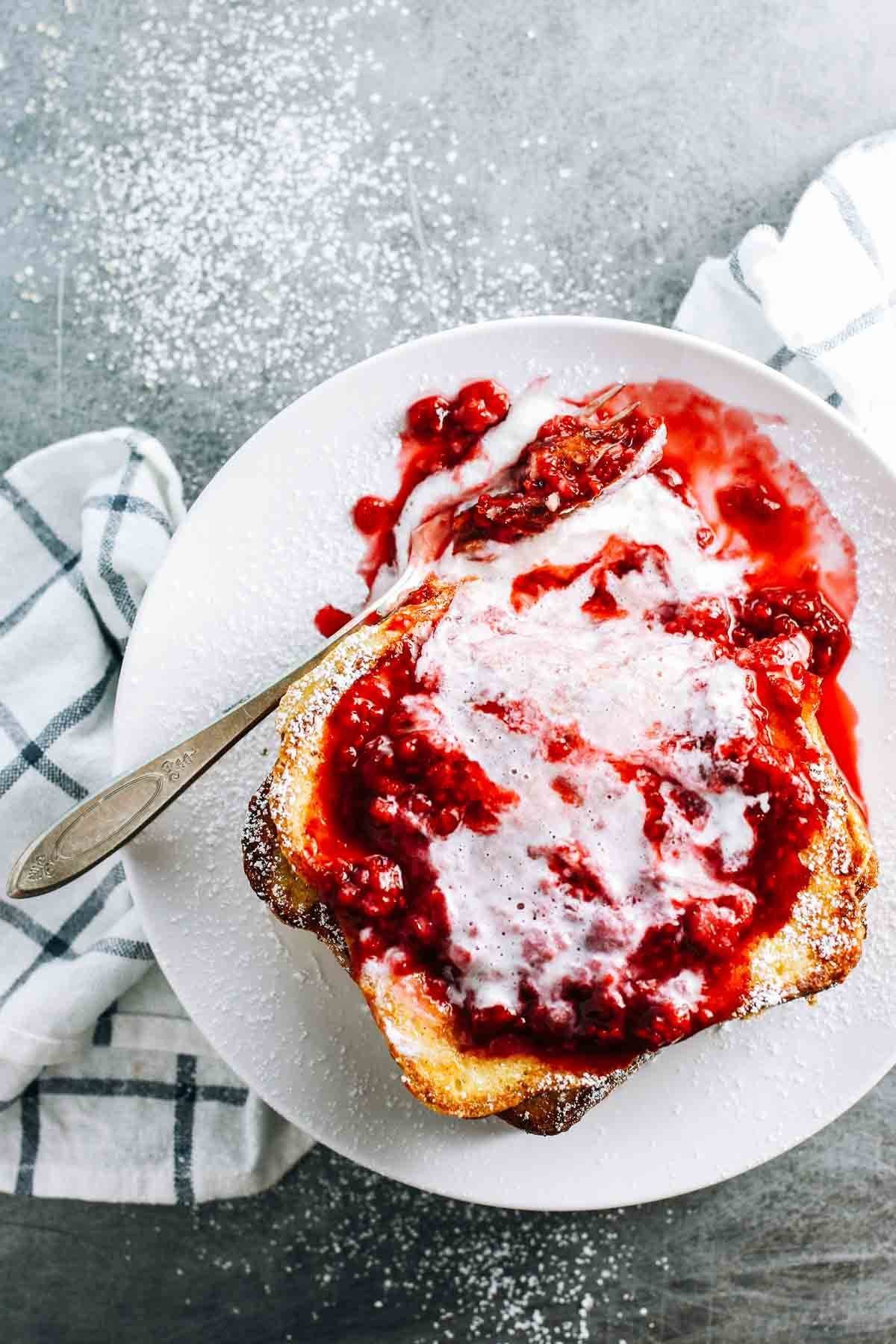 French Toast topped with a homemade raspberry sauce.