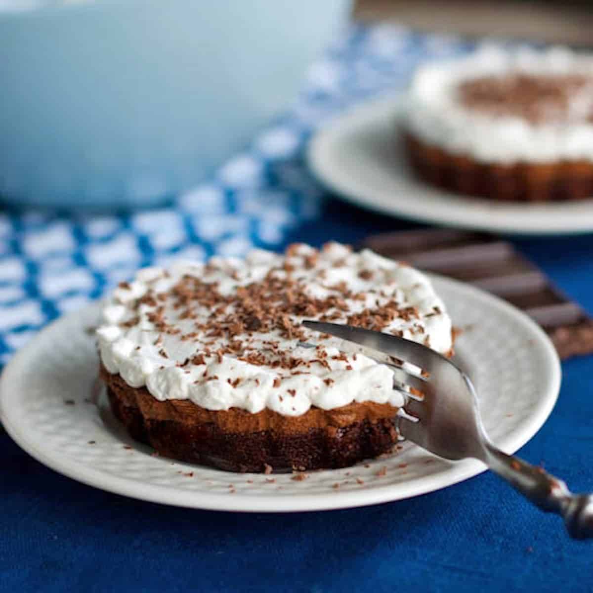 French silk brownie pie on a plate with a fork.