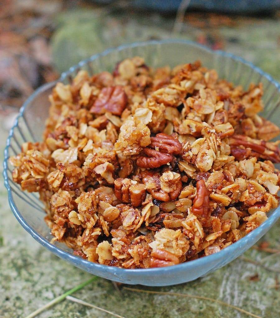 Pecan granola in a glass bowl.