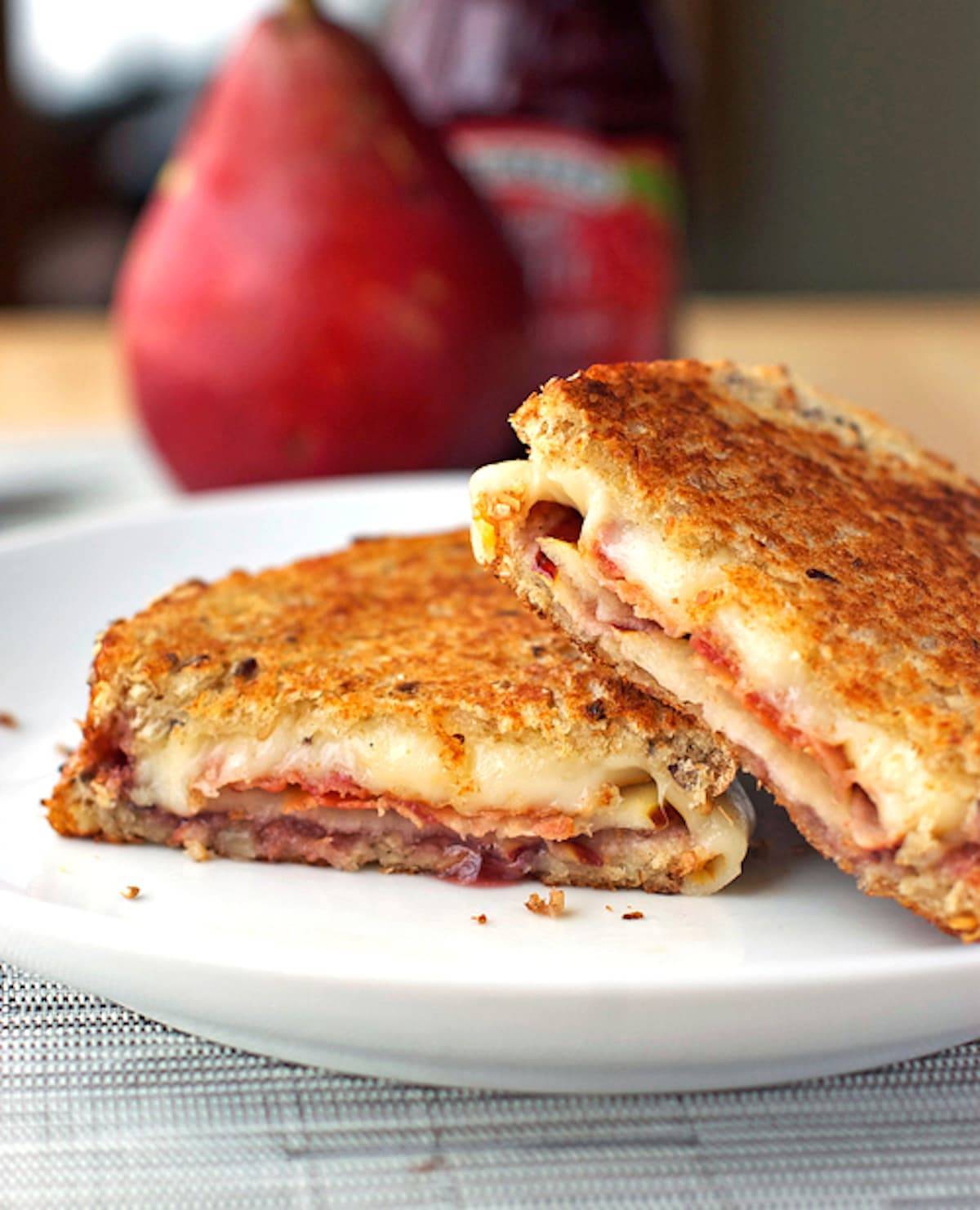 Grilled cheese sandwich stuffed with bacon, pear slices, and raspberry preserves.