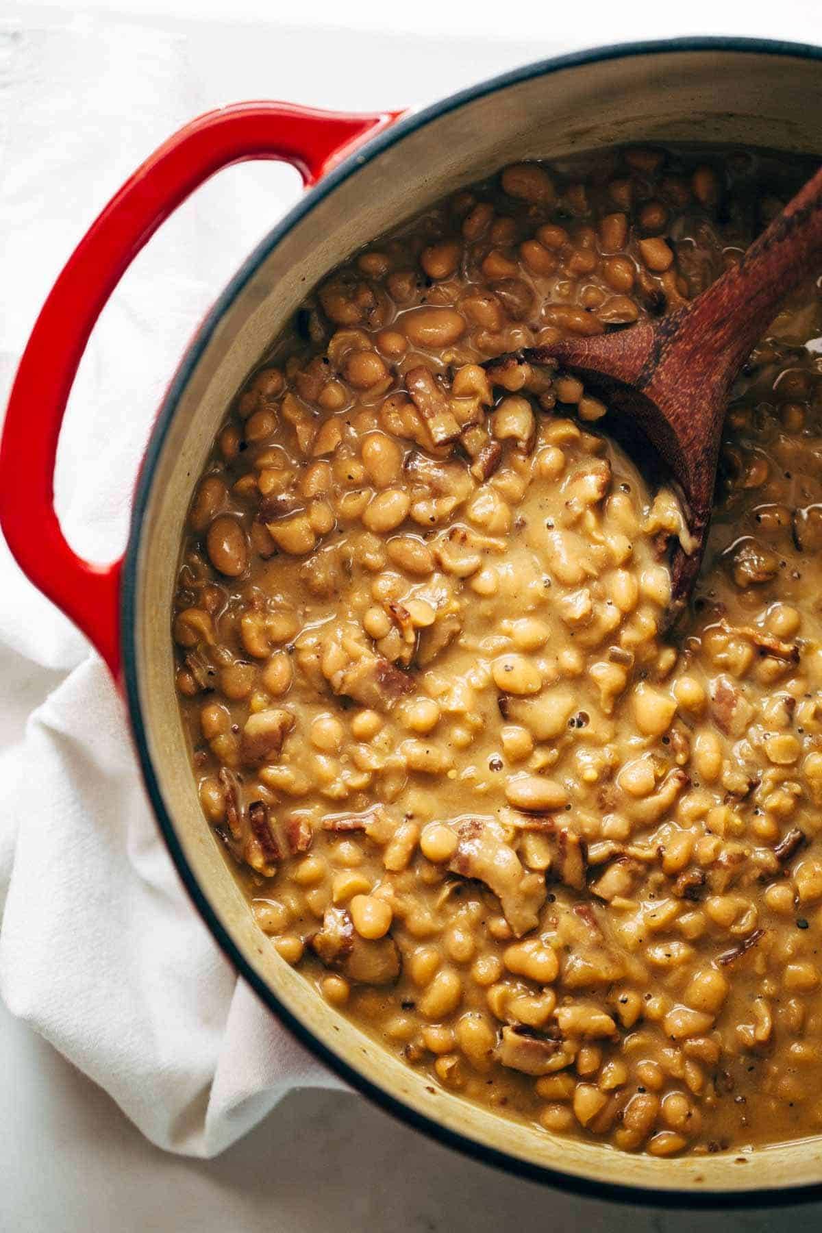 Homemade Brown Sugar Baked Beans! They are saucy, semi-creamy, brown sugar sweet + smoky bacon salty, and deliciously comforting. Five basic ingredients! | pinchofyum.com