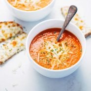 Simple Homemade Tomato Soup in bowls with spoon.