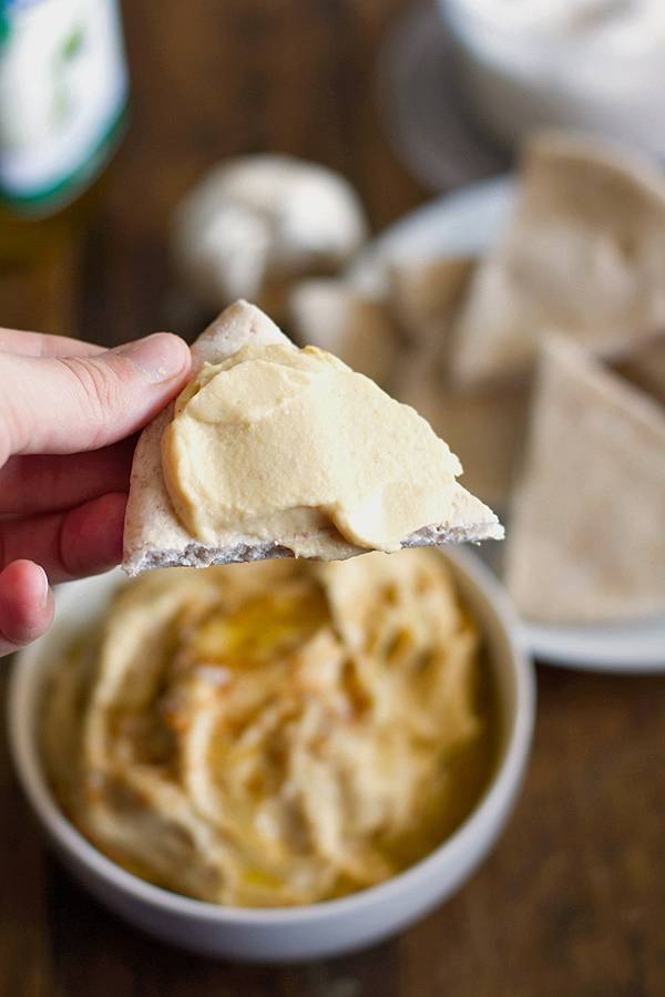 Hummus on a pita chip.
