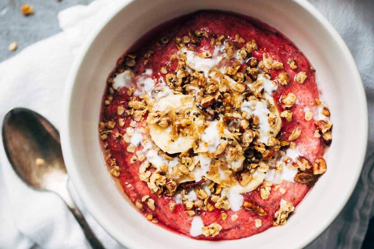 Inner Goddess Raspberry Breakfast Bowl with a spoon.