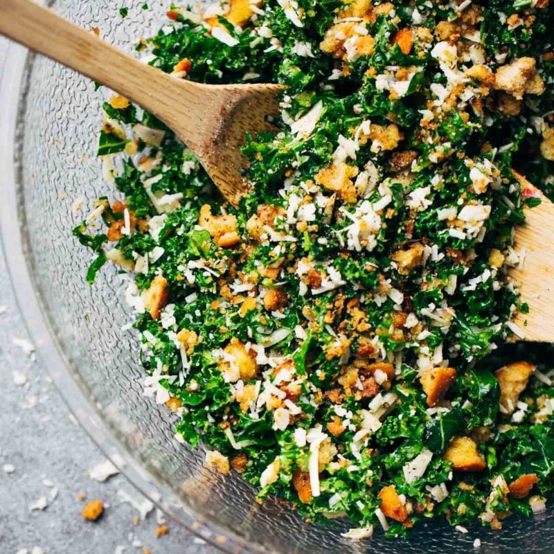 The Best Simple Kale Salad featuring a lemon and olive oil dressing, homemade breadcrumbs, and Parmesan cheese. YUM!