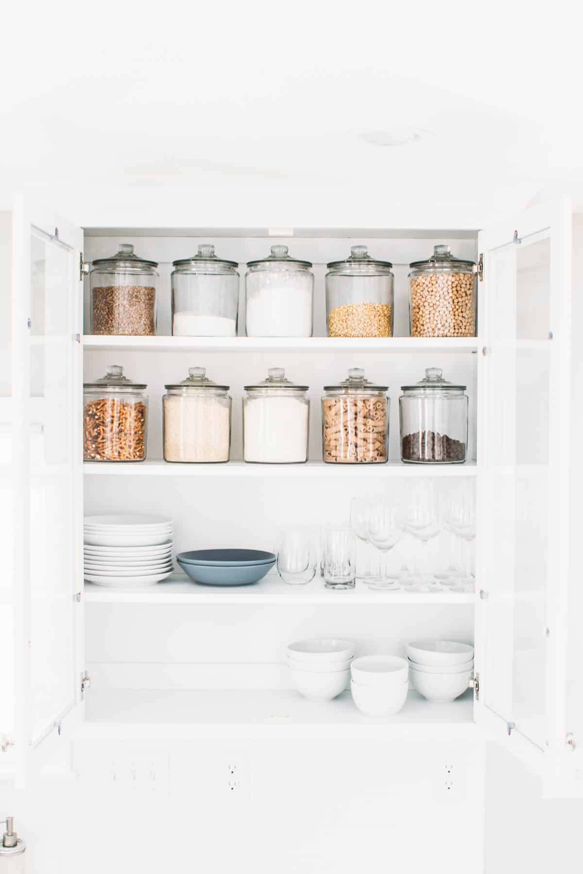 Cupboard with containers and dishes.