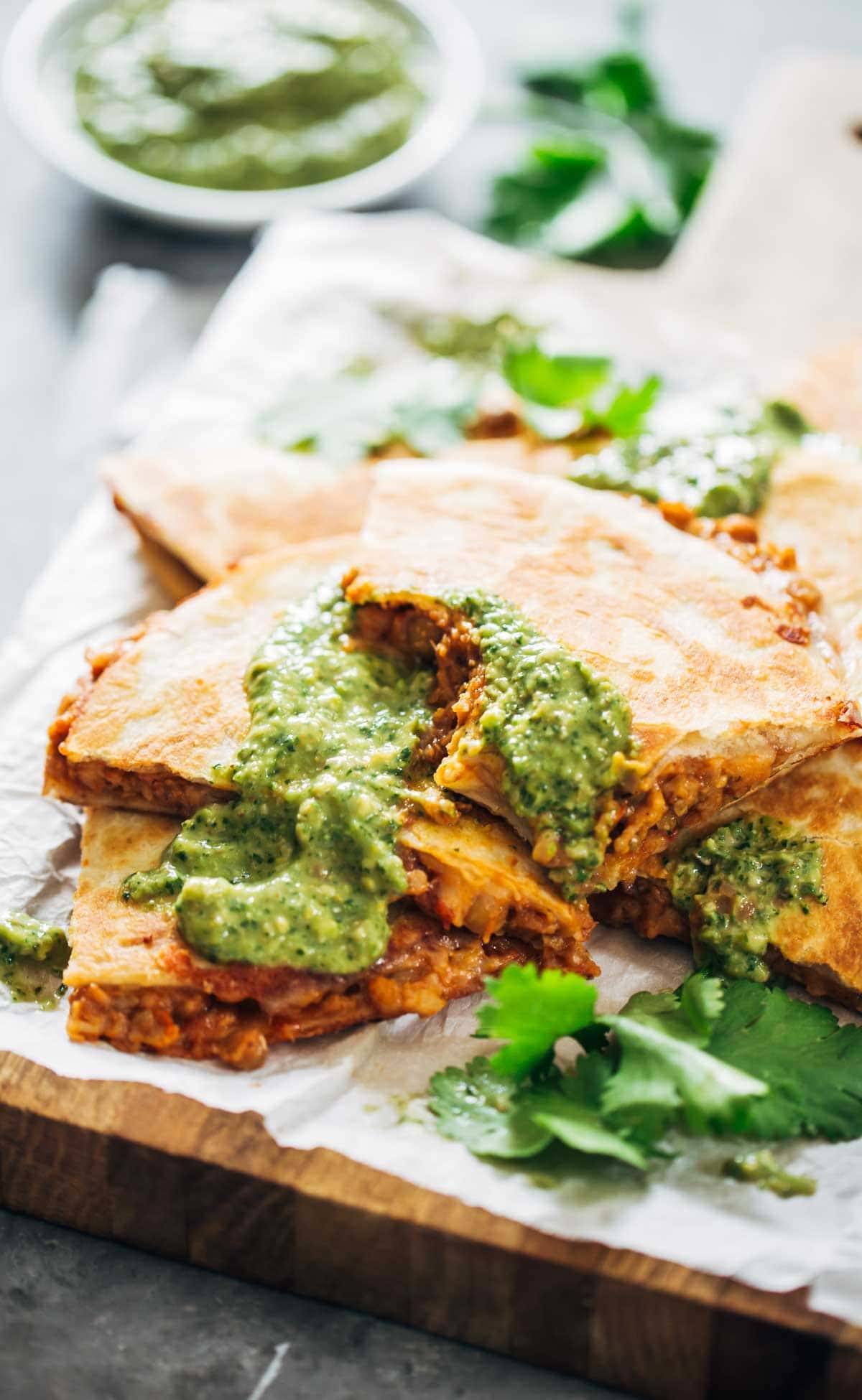 Quesadillas with magic green sauce.