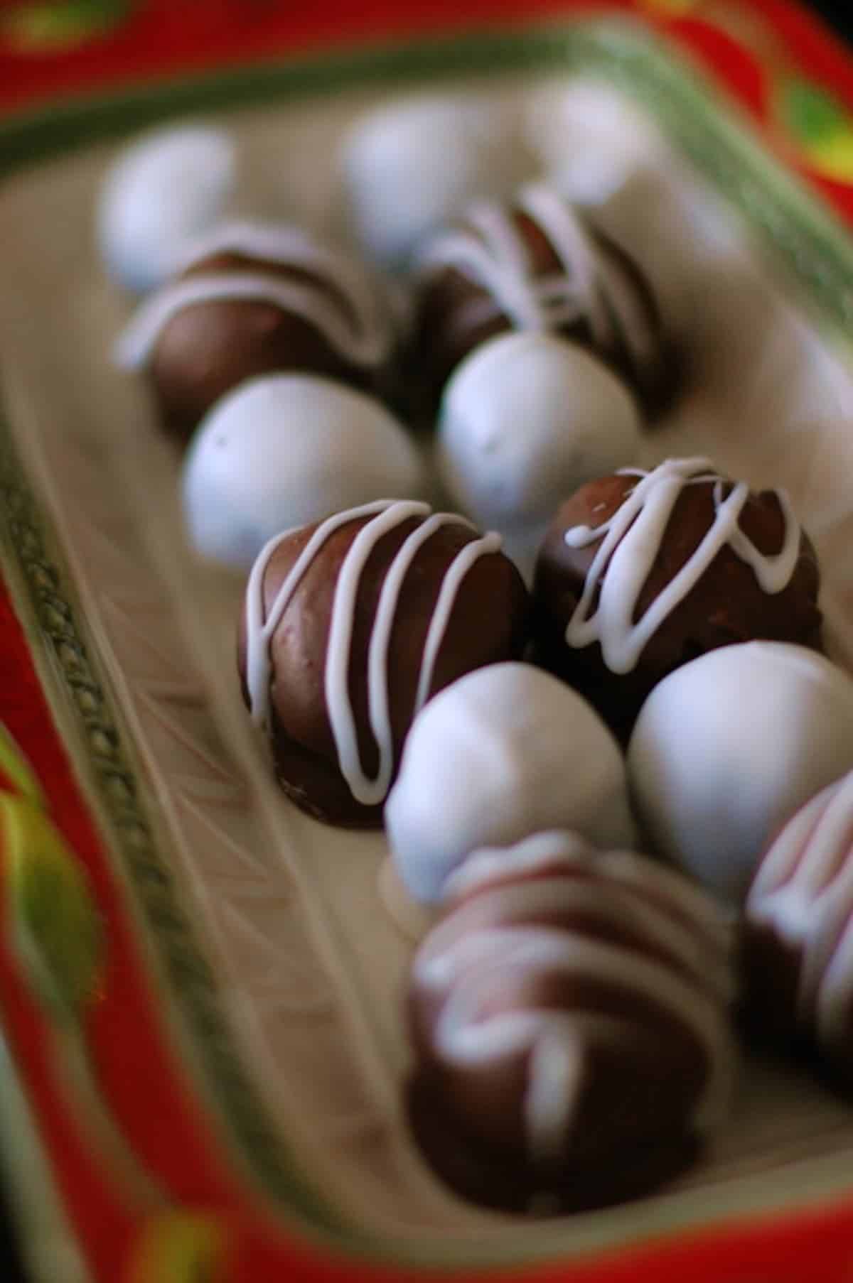 Minty Chocolate Oreo Truffles in a red and green tin pan.