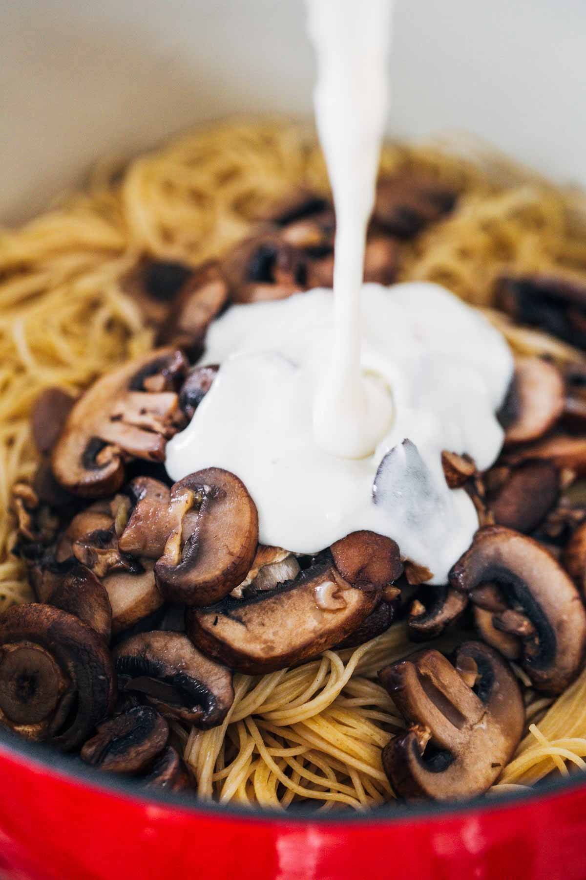 Cream on mushrooms and noodles.