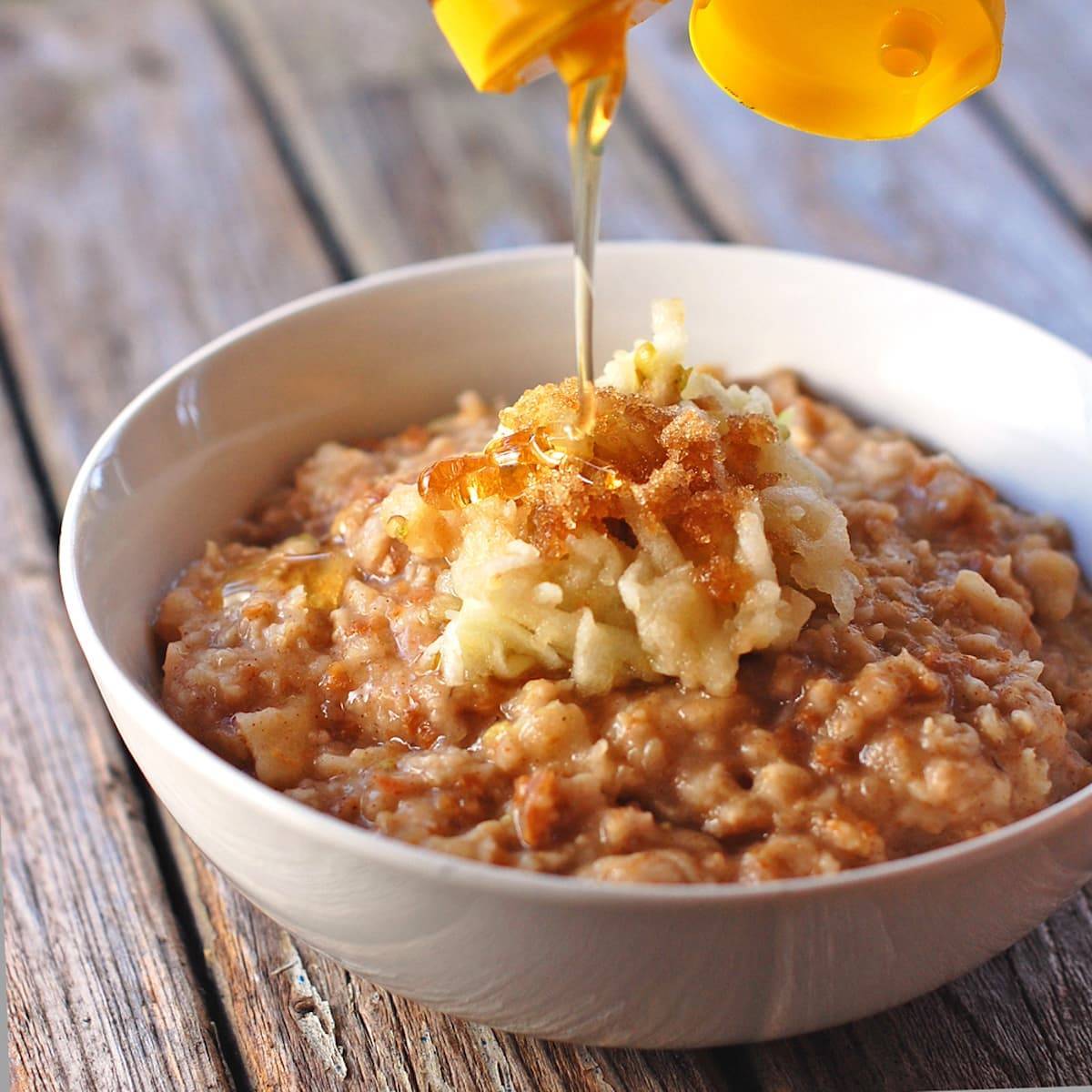 Brown sugar apple bran oatmeal with honey drizzle.