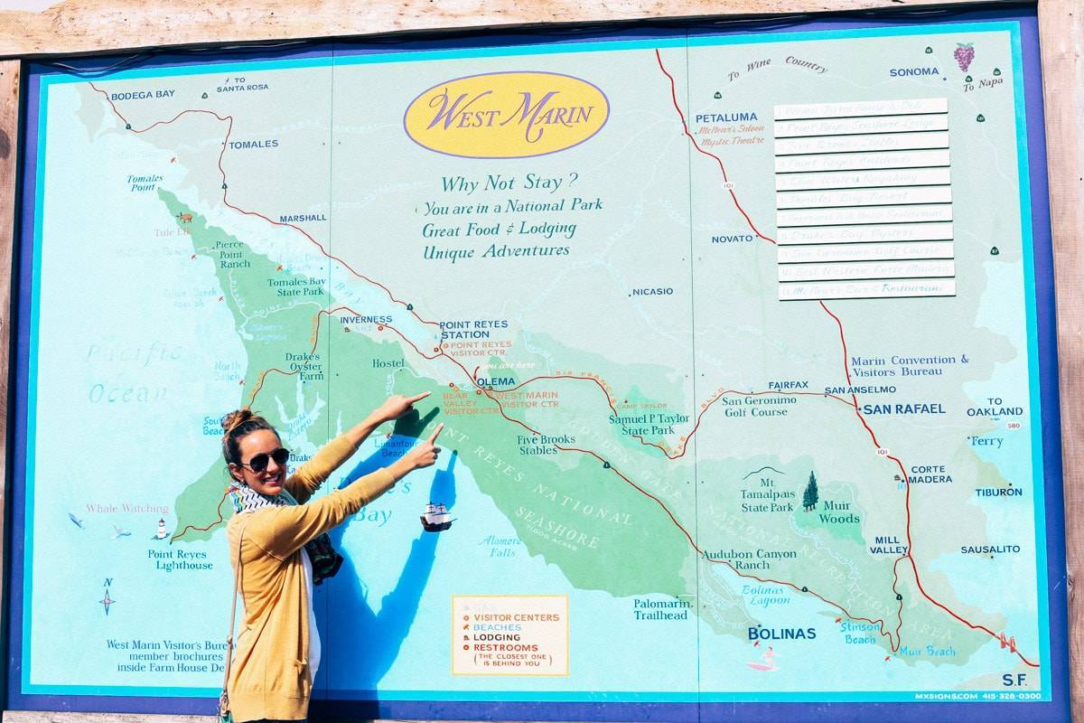 Woman pointing at a map.