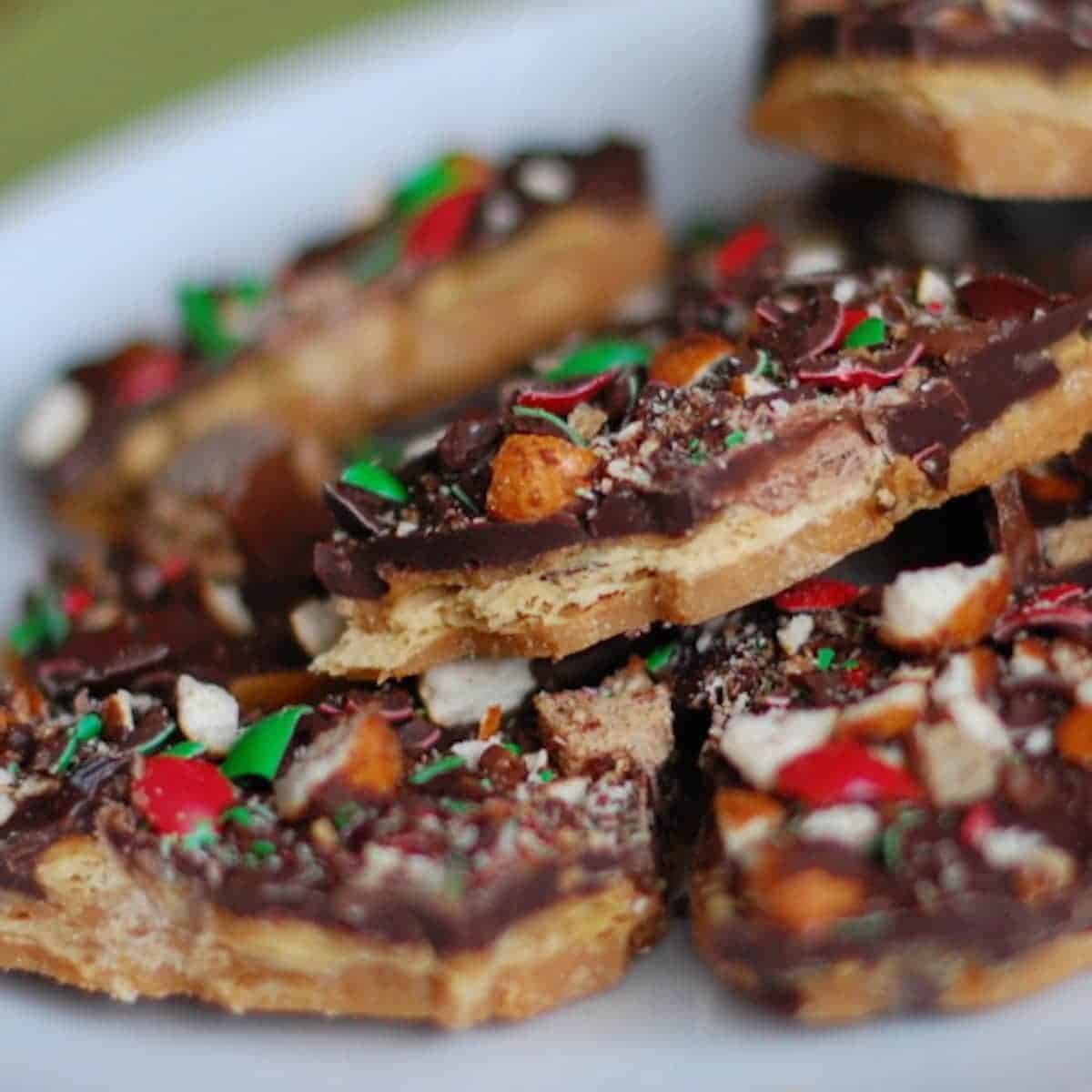 Pieces of salted toffee with colorful chocolate candy topping.