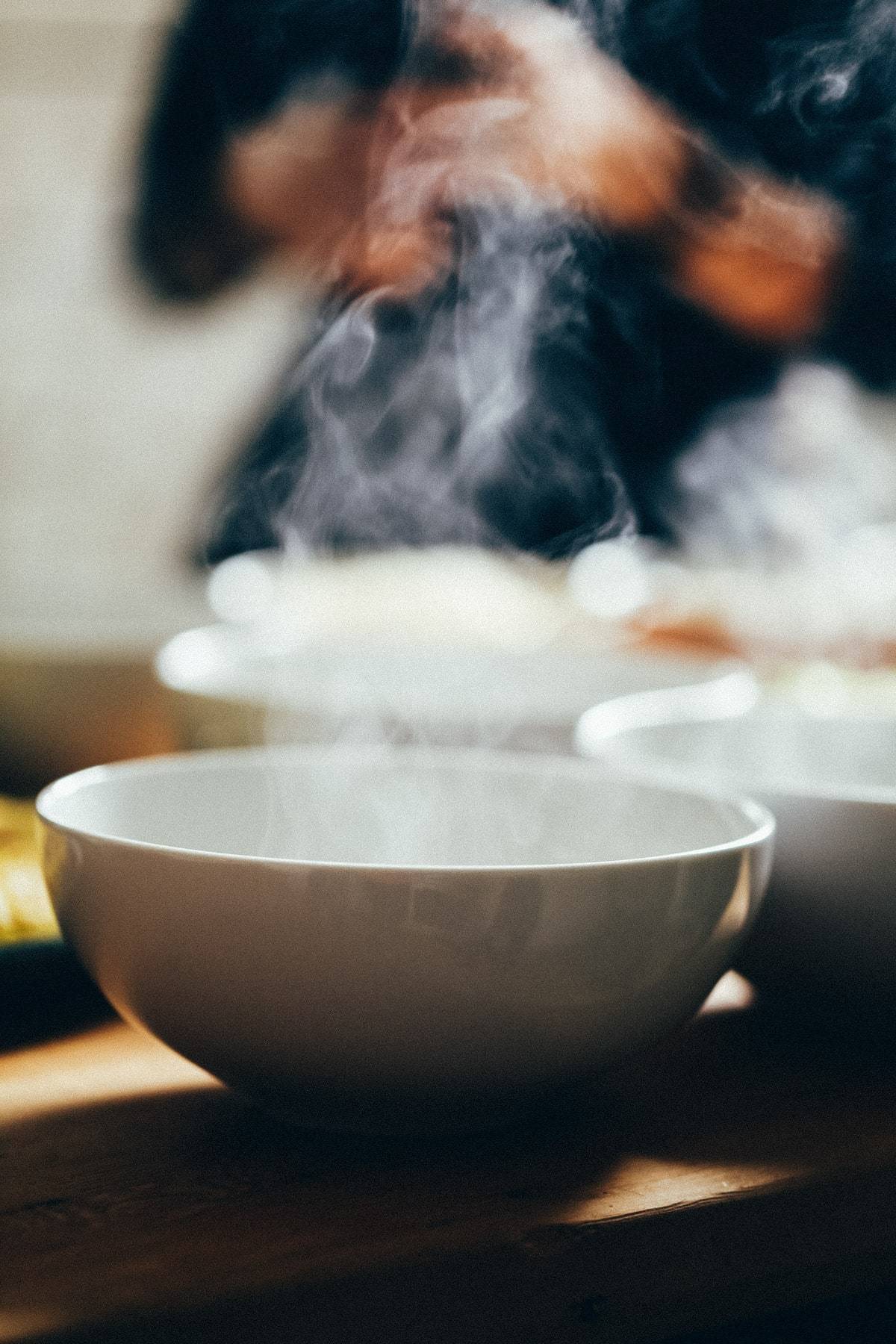 White bowls with steam.