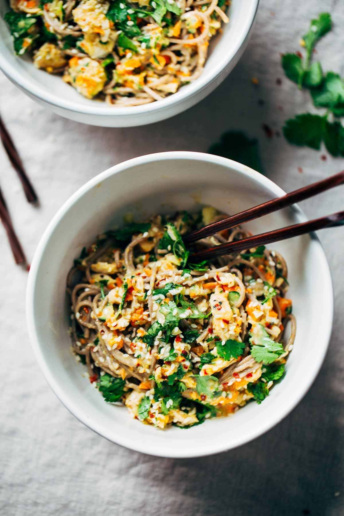 Chopped Chicken Sesame Noodle Bowls with chopsticks.