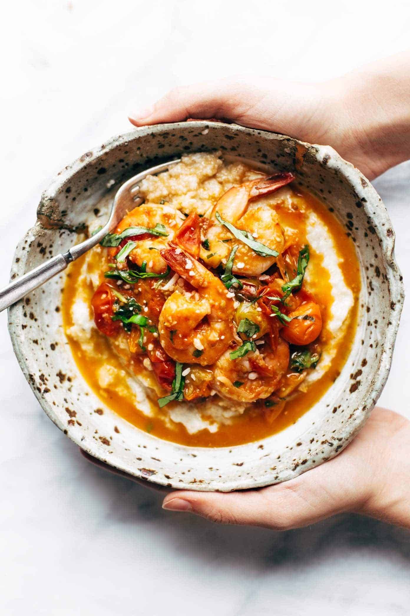 Shrimp + Grits in a bowl with a fork.
