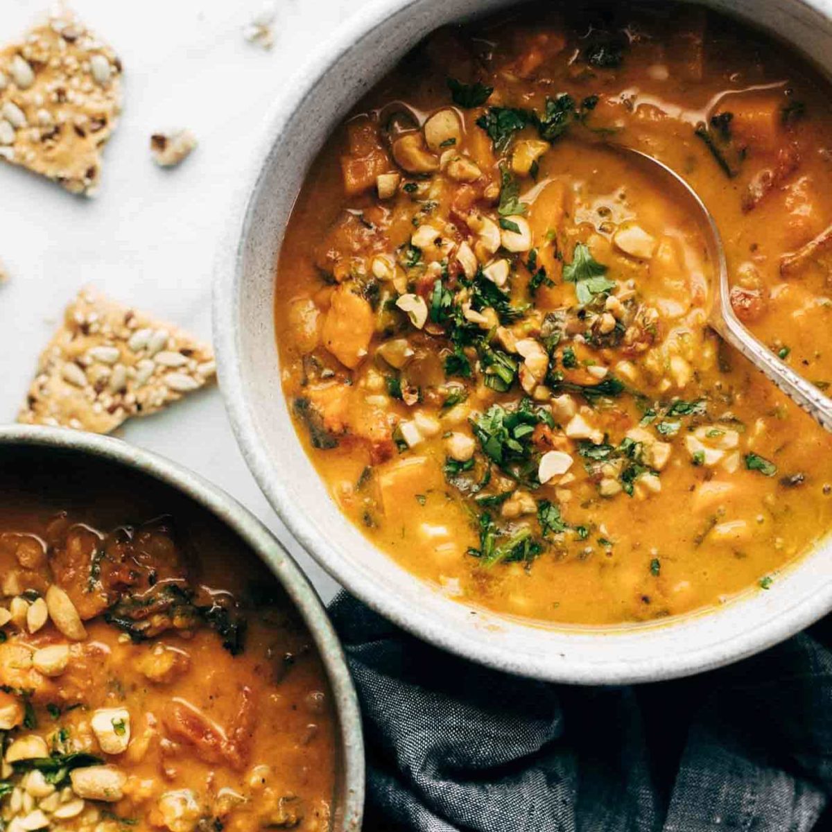 Spicy Peanut Soup with Sweet Potato + Kale Recipe - Pinch of Yum