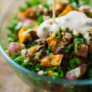 Roasted Sweet Potato Salad with dressing poured on.
