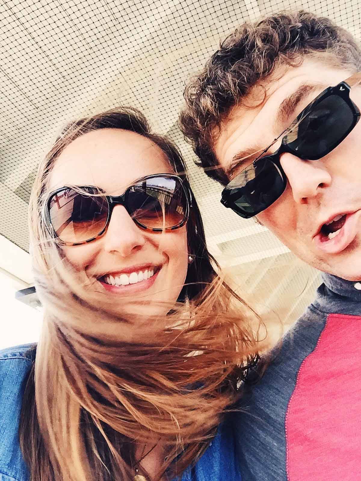 Man and woman wearing sunglasses.