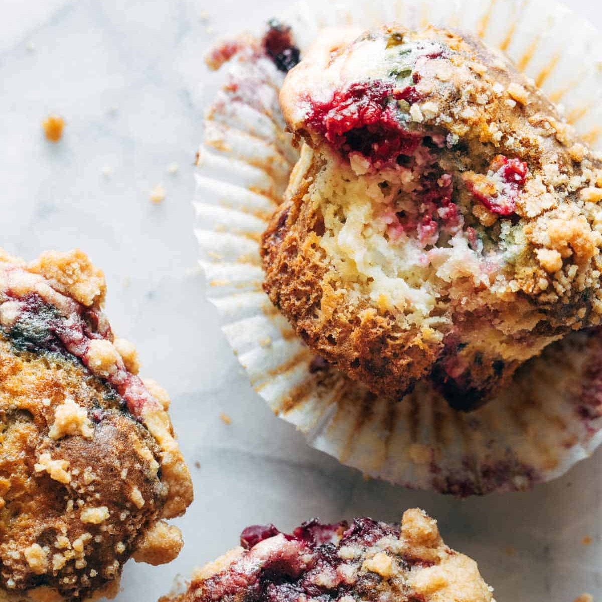 Juicy berries, a luscious cheesecake layer, and some heavy streusel on top a muffin.