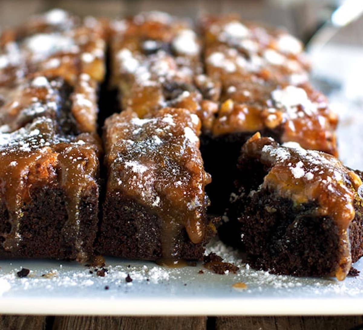 Chocolate peanut butter banana upside down cake cut into pieces.