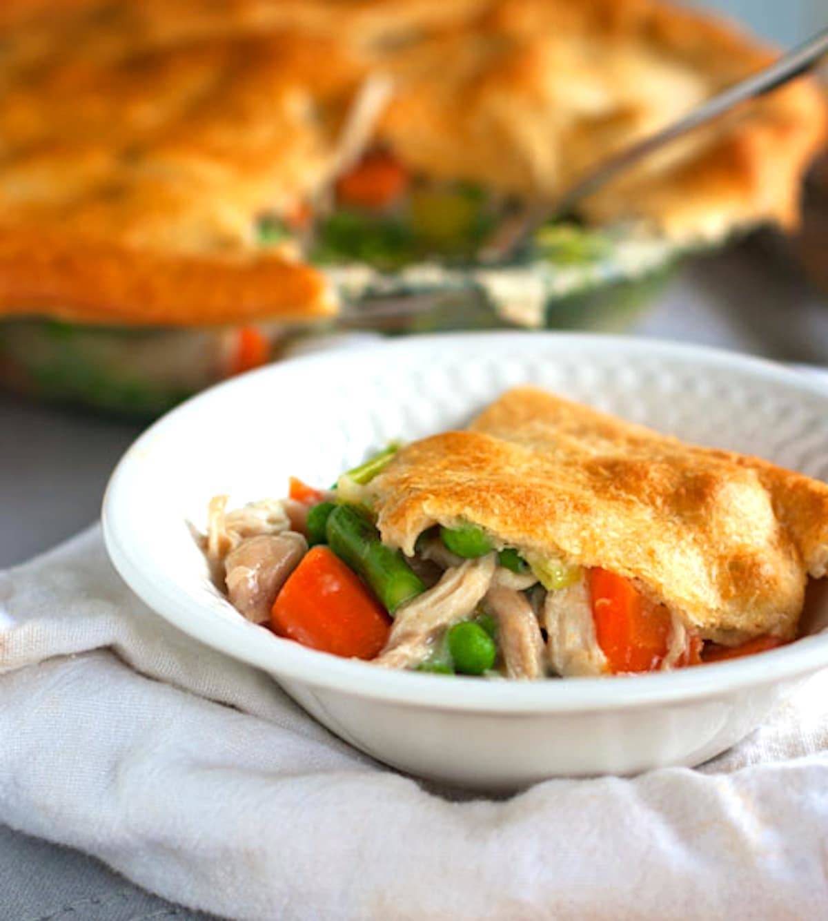 Garlic chicken and vegetable pot pie in a bowl.