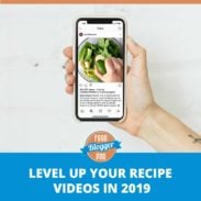 Hand holding iPhone with level up your recipe videos in 2019 graphic.