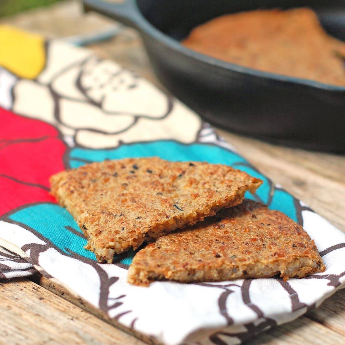 Wild rice flatbread on a colorful piece of fabric.
